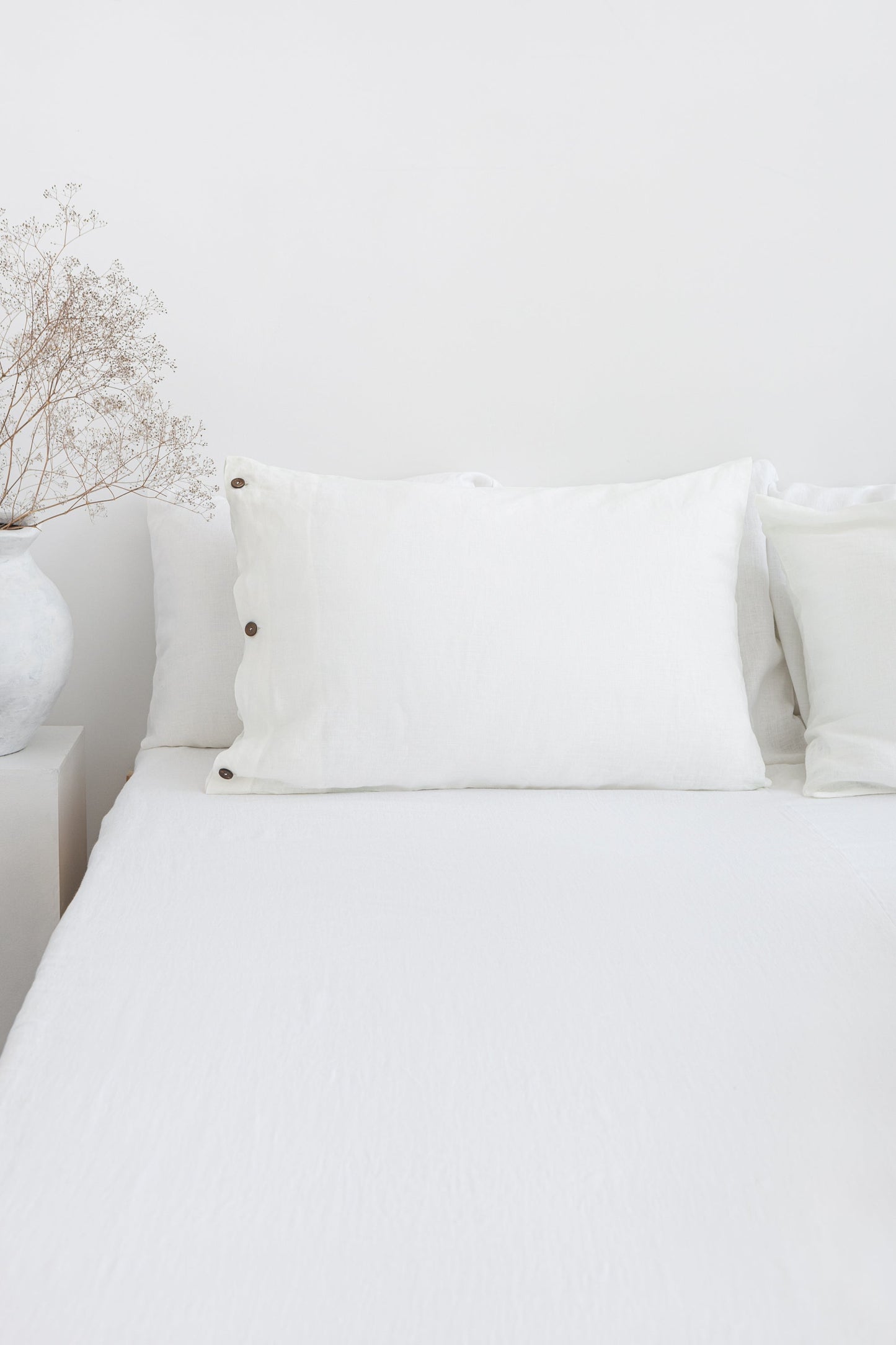 White linen bedding set with coconut buttons