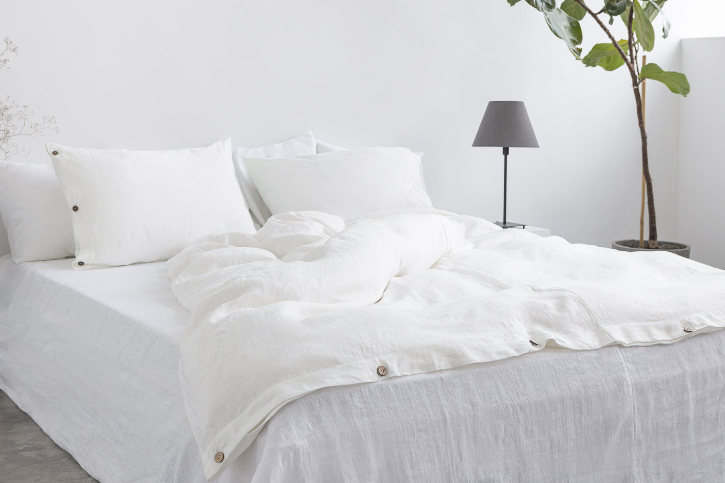 White linen bedding set with coconut buttons